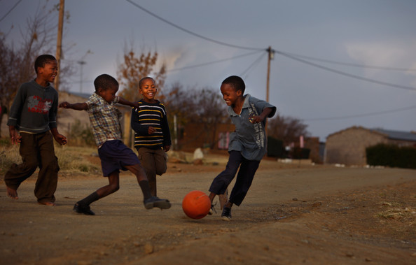 Children Playing Football In The Street