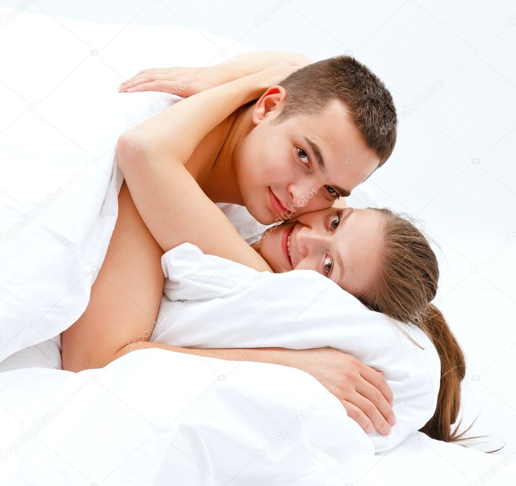 Couples Hugging In Bed