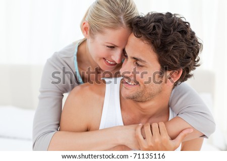 Couples Hugging In Bed