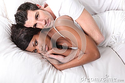 Couples Hugging In Bed