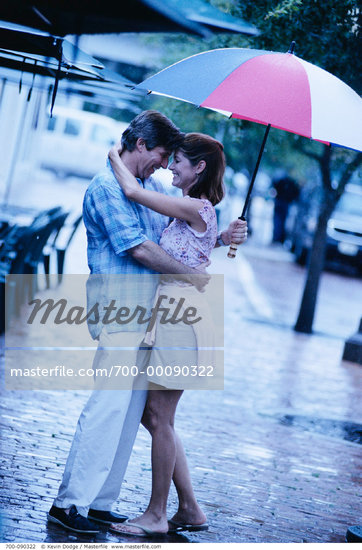 Couples Hugging In Rain